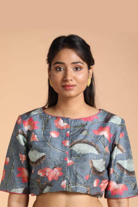 Blue coloured Pichwai printed blouse crafted from luxurious raw silk fabric.