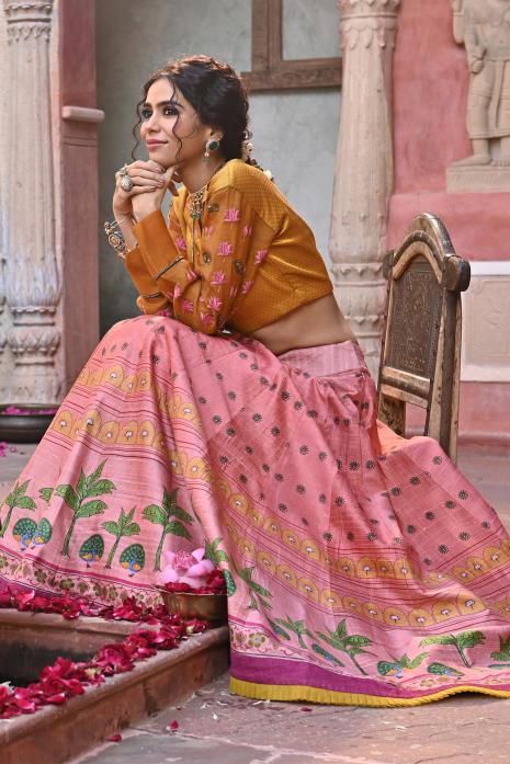 A beautiful hand-painted and hand-embroidered lehenga set in peach colour